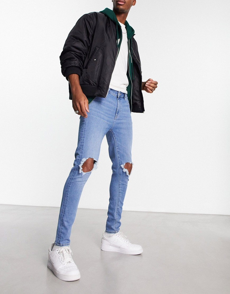 ASOS DESIGN spray on jeans with power stretch in classic wash with knee rips-Blue