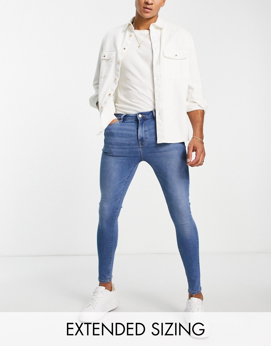 ASOS DESIGN spray on jeans with power stretch in classic wash-Blue