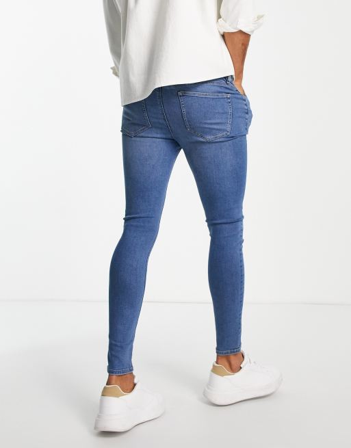 ASOS DESIGN spray on jeans in power stretch denim in light wash