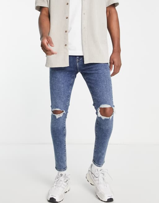 ASOS DESIGN on jeans with power in dark wash blue knee rips | ASOS