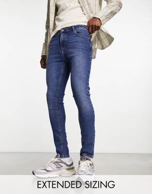 ASOS DESIGN spray on jeans with power stretch in dark wash blue