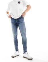 ASOS DESIGN spray on jeans in power stretch denim in light wash