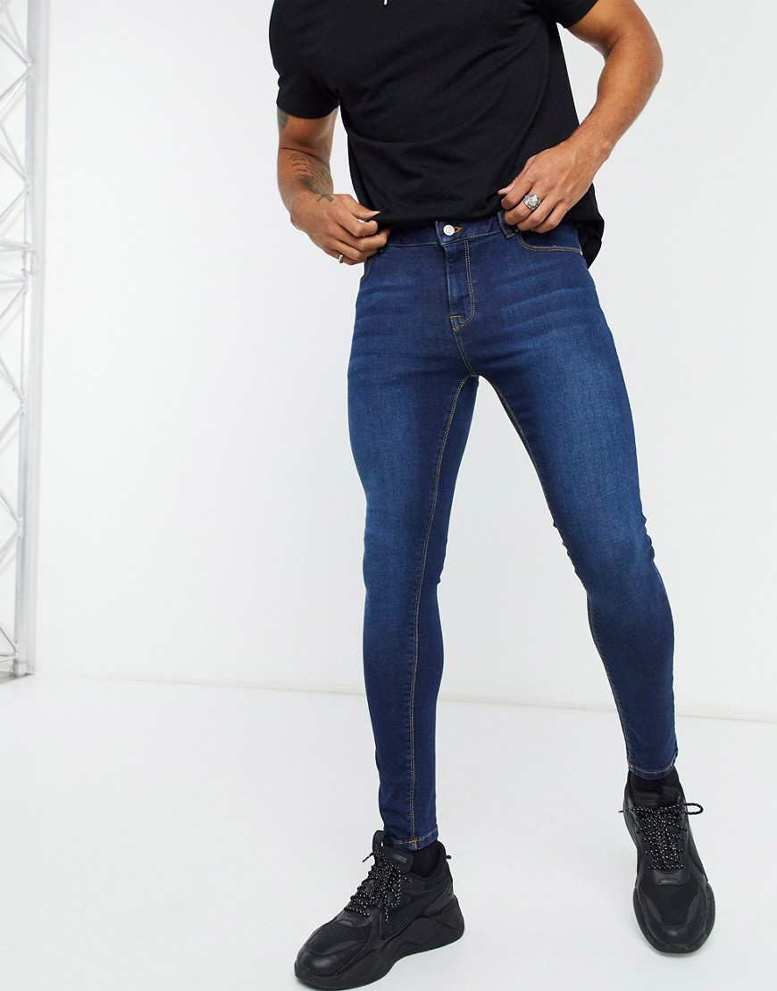ASOS DESIGN spray on jeans with power stretch in dark wash blue-Blues