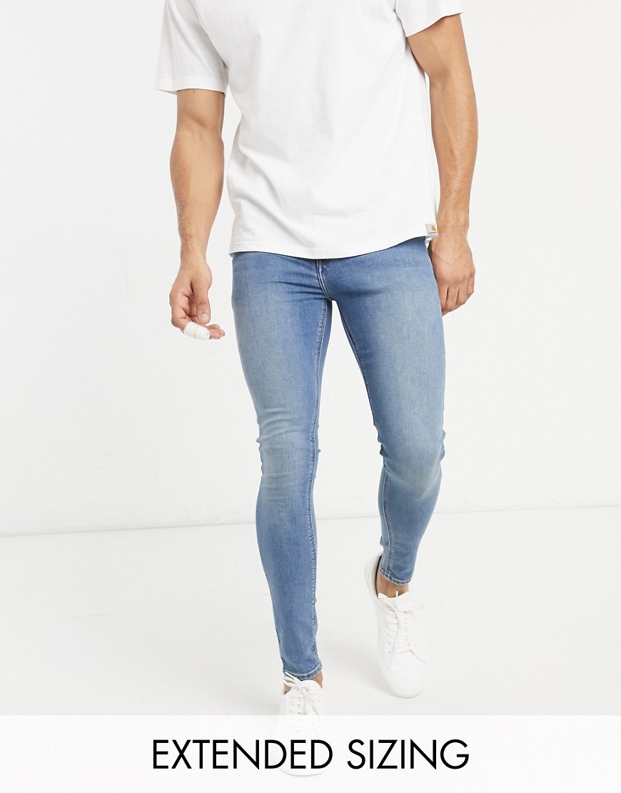 ASOS DESIGN spray on jeans with power stretch in dirty mid wash blue-Blues