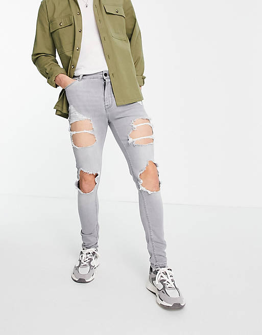 ASOS DESIGN spray on jeans with power stretch in grey with heavy rips