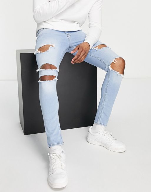 Asos Design Spray On Jeans With Power Stretch In Light Wash Blue With Heavy Rips Asos 