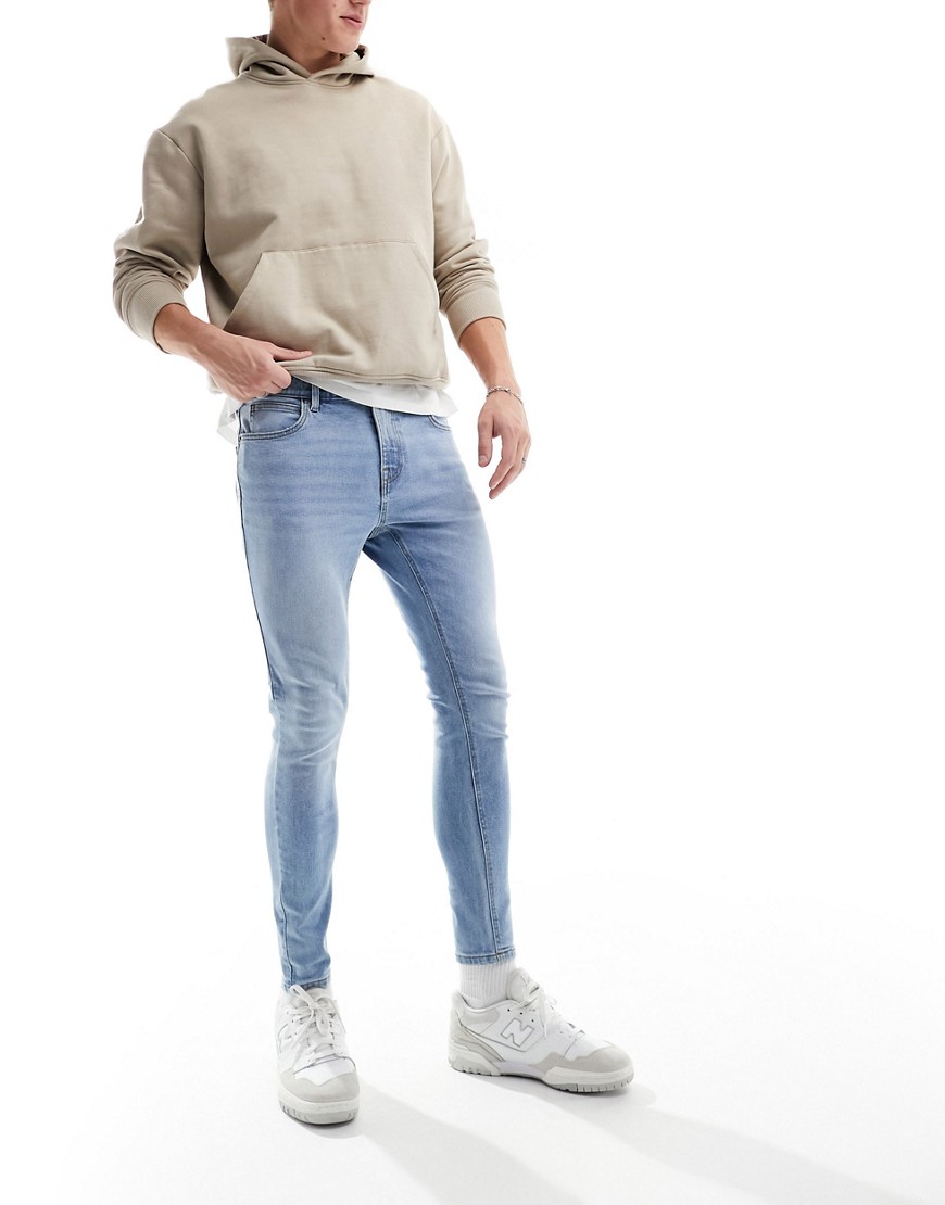 ASOS DESIGN spray on jeans with power-stretch in light wash blue