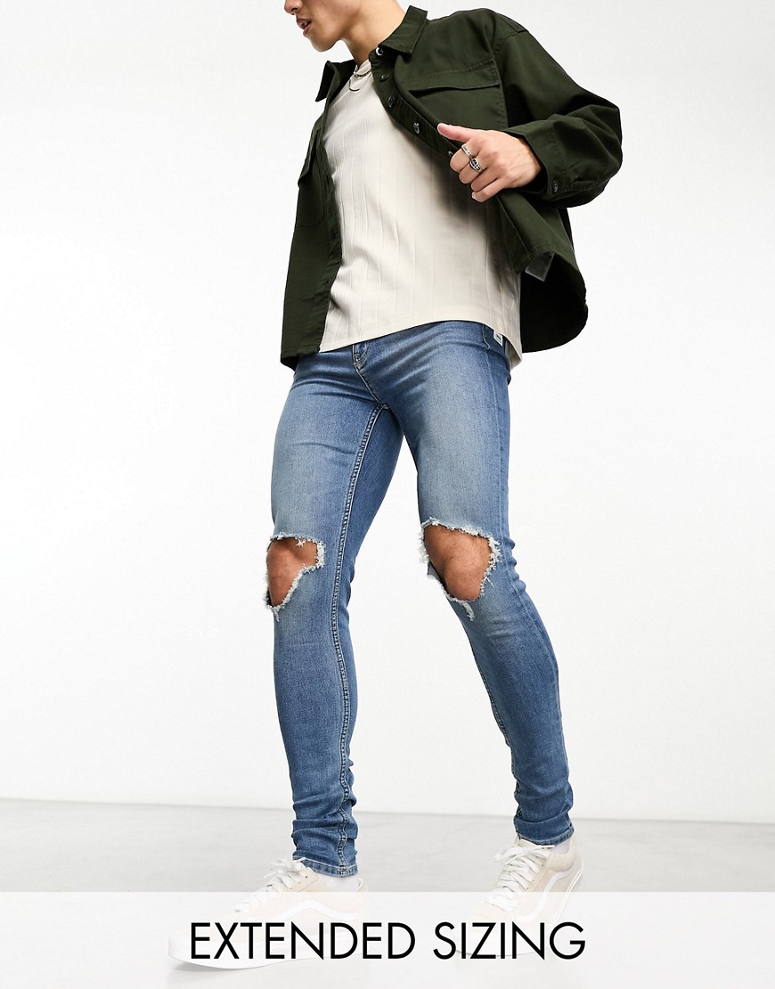 ASOS DESIGN spray on jeans with power stretch in light wash tint with knee rips-Blue