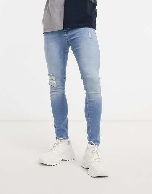 ASOS DESIGN spray on jeans in power stretch denim in light wash