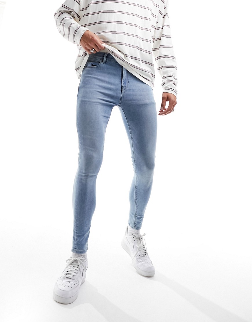 ASOS DESIGN spray on jeans with power stretch in light wash-Blue
