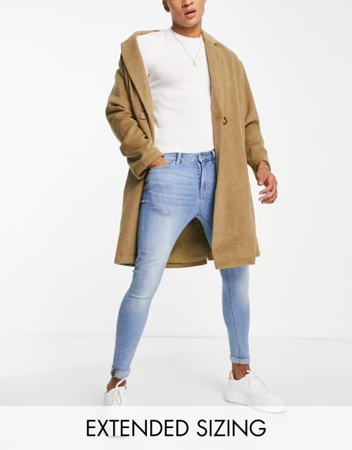 ASOS DESIGN spray on jeans in power stretch denim in light wash