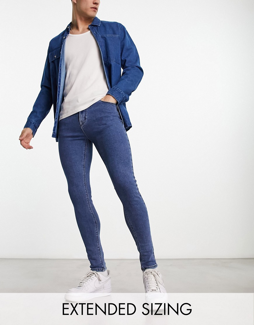 ASOS DESIGN spray on jeans with power stretch in mid blue