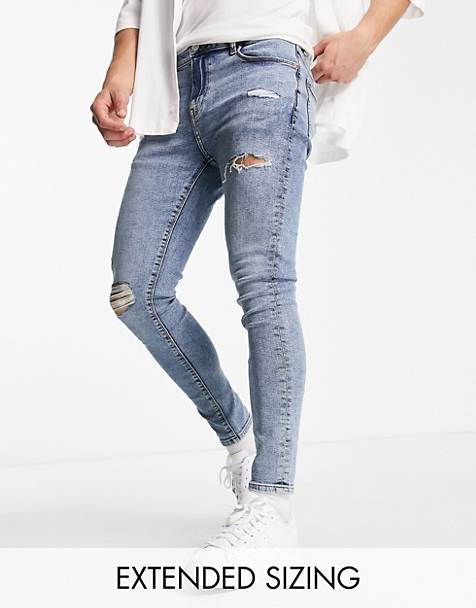 Relaxed skinny jeans with rips in ASOS Herren Kleidung Hosen & Jeans Jeans Tapered Jeans 
