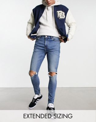 ASOS DESIGN spray on jeans with power stretch in mid wash blue with knee rips    - ASOS Price Checker
