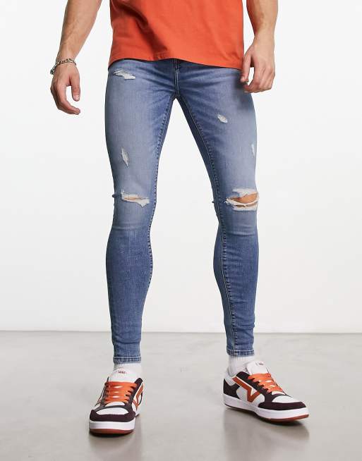 ASOS DESIGN super skinny jeans in mid wash blue with abrasions