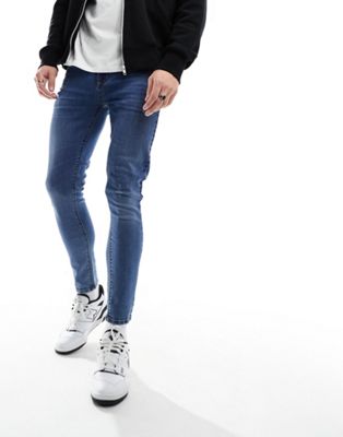 Asos Design Spray On Jeans With Power-stretch In Mid Wash Blue