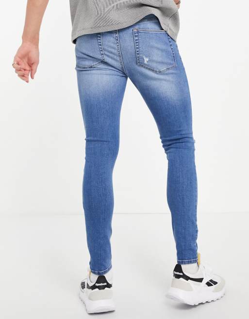 ASOS DESIGN spray on denim shorts in power stretch mid wash