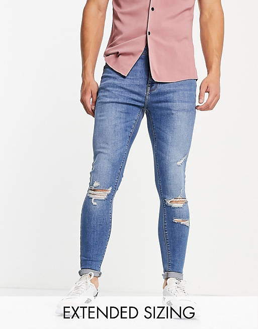ASOS DESIGN spray on jeans with power stretch in mid wash with rips