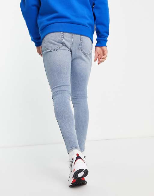 ASOS DESIGN spray on jeans in power stretch denim in light wash