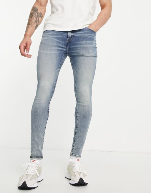 ASOS DESIGN spray on denim shorts in power stretch mid wash