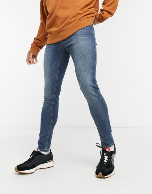 ASOS DESIGN spray on jeans with power stretch in vintage dark wash