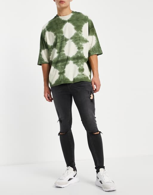 ASOS DESIGN spray on jeans with power stretch in washed black with heavy rips