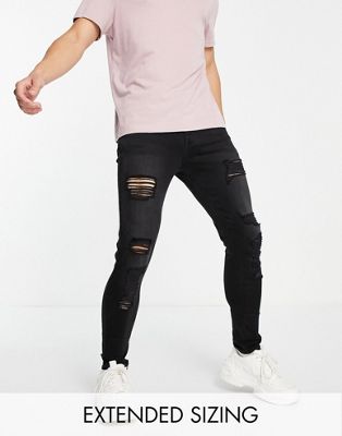ASOS DESIGN spray on jeans with power stretch in washed black with heavy rips