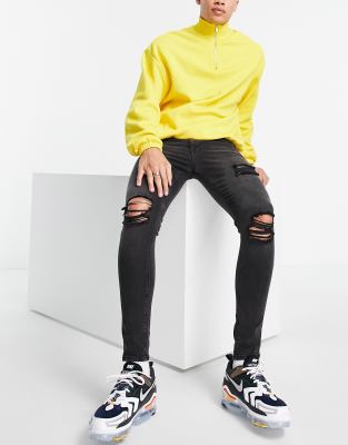 jeans with yellow rips