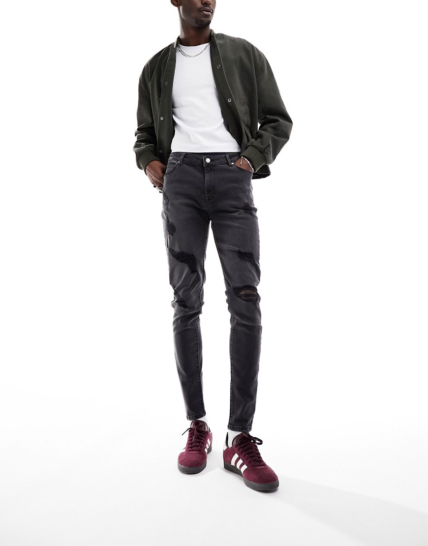 ASOS DESIGN spray on jeans with power stretch in washed black with rips