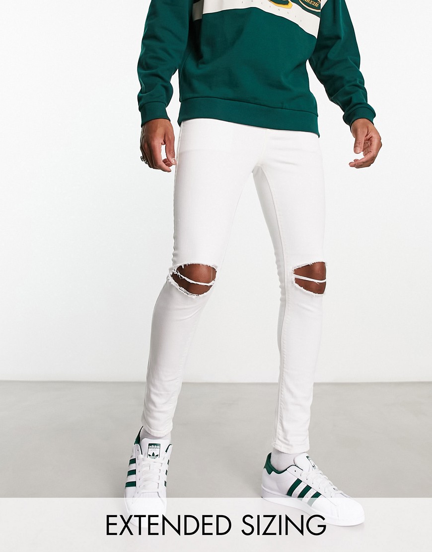 ASOS DESIGN spray on jeans with power stretch in white with rips