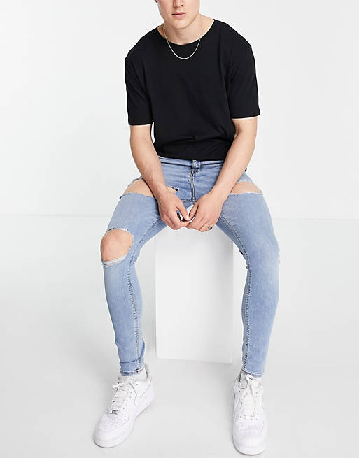 ASOS DESIGN spray on jeans with power stretch light wash with rips