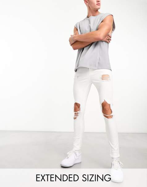 ASOS DESIGN spray on jeans with power stretch with heavy rips in white