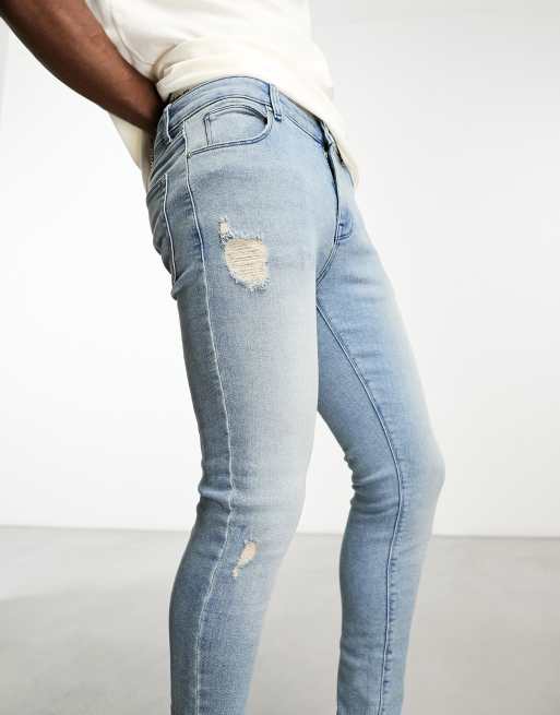 ASOS DESIGN spray on jeans with power stretch with rips in blue