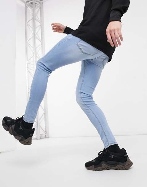 ASOS DESIGN spray on jeans with powerstretch in light wash blue - view 1
