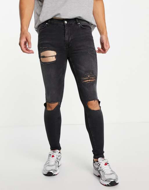ASOS DESIGN spray on jeans with powerstretch in washed black with heavy rip