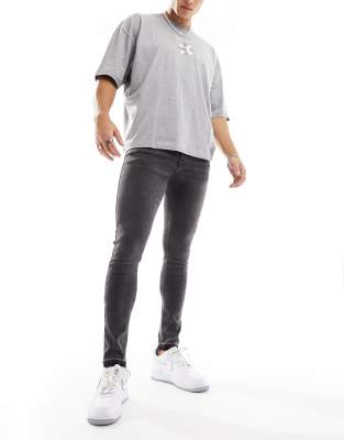 Asos Design Spray On Jeans With Power Stretch In Washed Black In Black