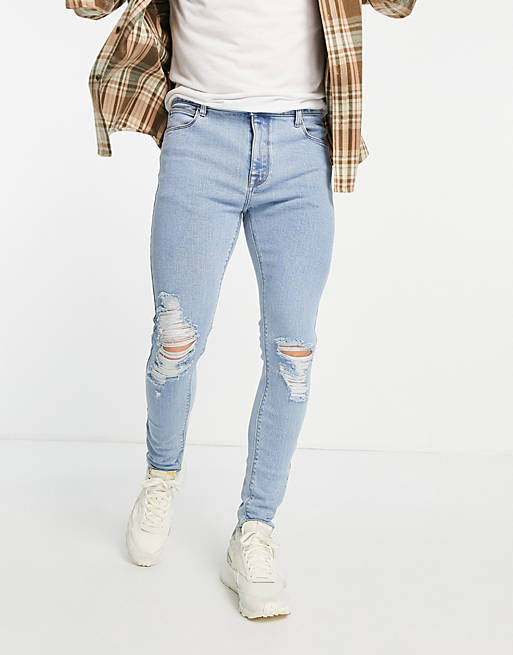 ASOS DESIGN spray on 'vintage look' jeans with powerstretch in light wash with knee rips