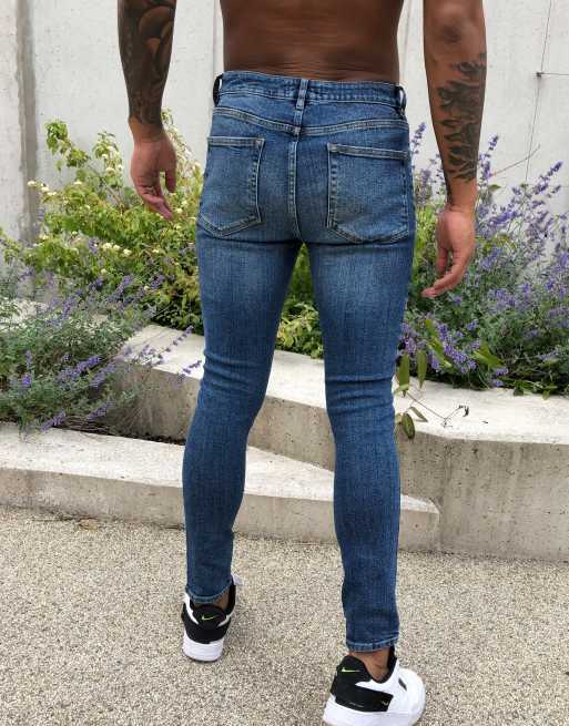 ASOS DESIGN spray on'vintage look' jeans with power stretch in dark wash blue with abrasions, 2 of 4