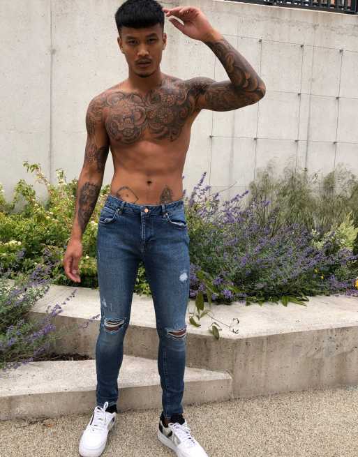 ASOS DESIGN spray on'vintage look' jeans with power stretch in dark wash blue with abrasions, 4 of 4