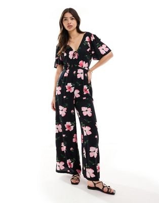 ASOS DESIGN spun flutter sleeve wide leg jumpsuit in dark based floral print
