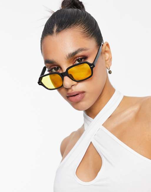 Black glasses shop with yellow lenses