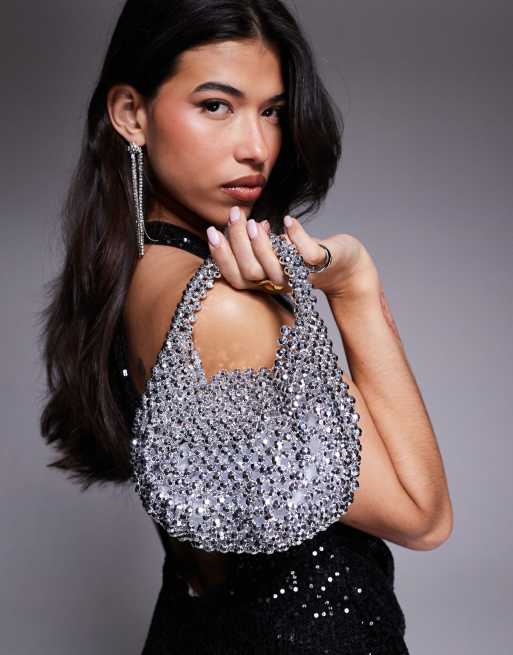 ASOS DESIGN – Srebrna kopertówka z klapką zdobiona metalicznymi koralikami