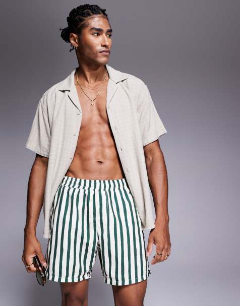 ASOS DESIGN swim shorts in mid length in green stripe