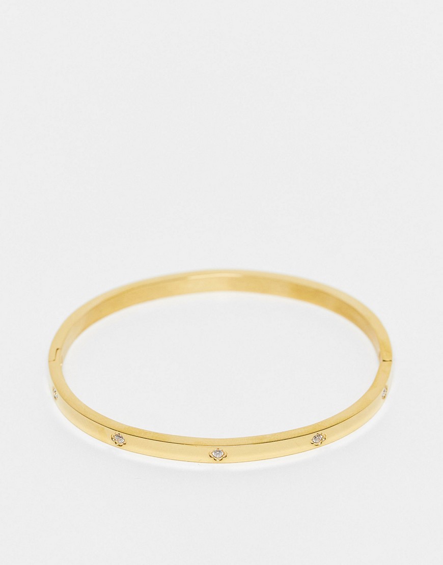 ASOS DESIGN stainless steel bangle with crystal design in gold tone