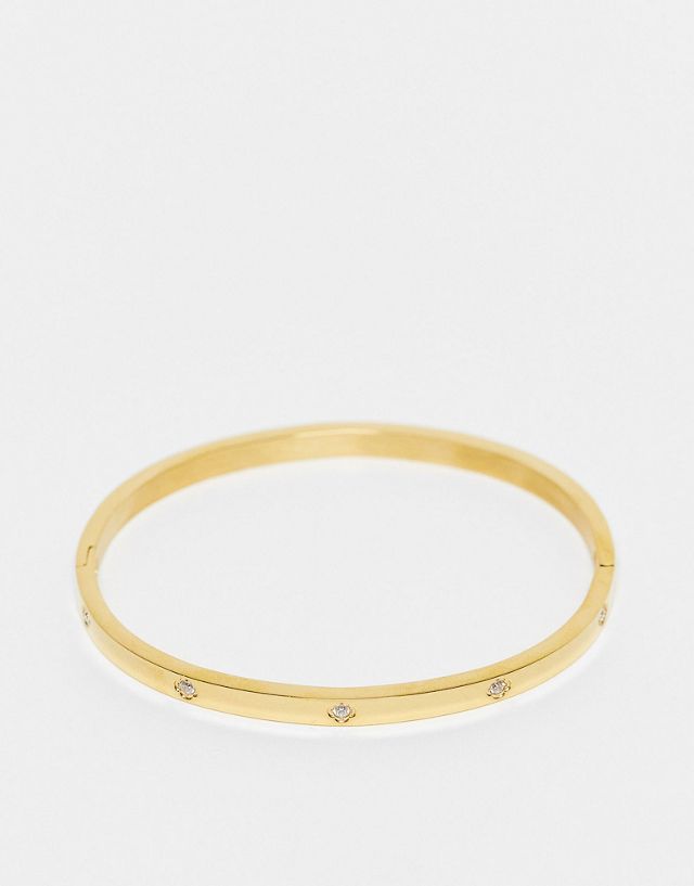 ASOS DESIGN stainless steel bangle with crystal design in gold tone