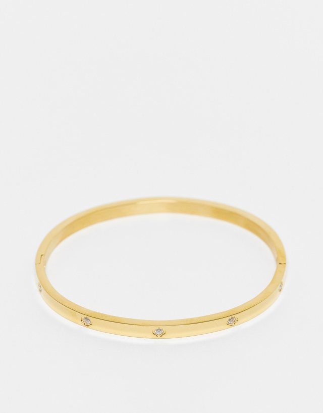 ASOS DESIGN stainless steel bangle with crystal design in gold tone