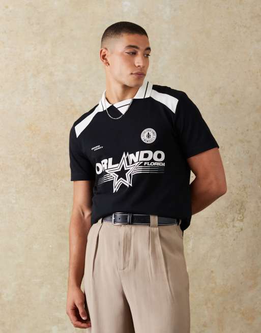ASOS DESIGN standard fit polo with city graphic in black
