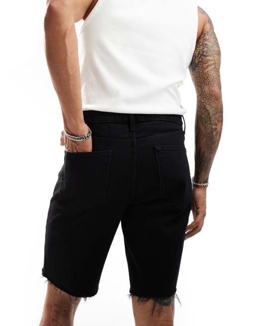 ASOS DESIGN standard length vintage slim denim shorts with rip hem in black