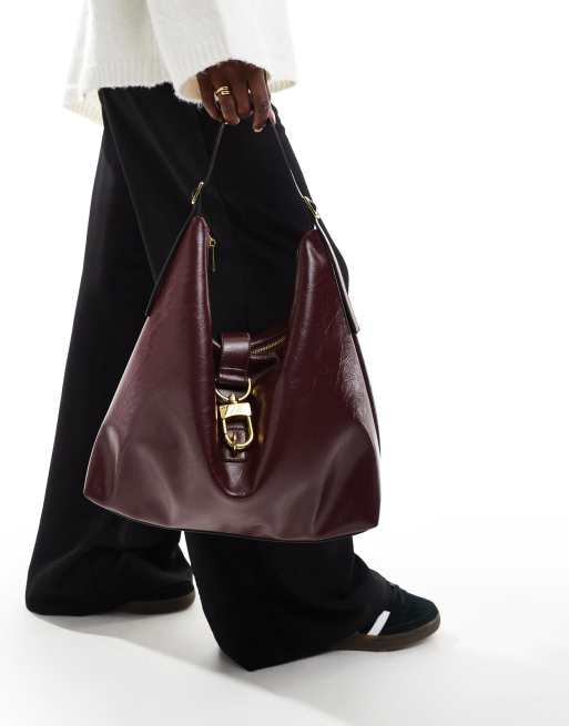 ASOS DESIGN statement buckle slouchy tote bag in burgundy