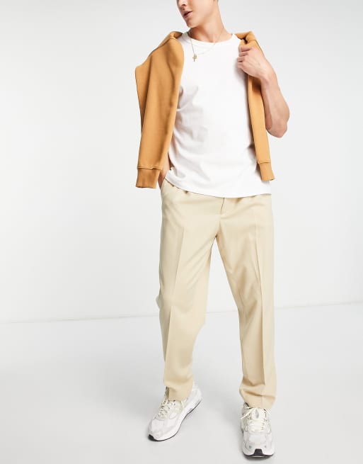 ASOS DESIGN – Stenfärgade, avsmalnande finbyxor i oversize